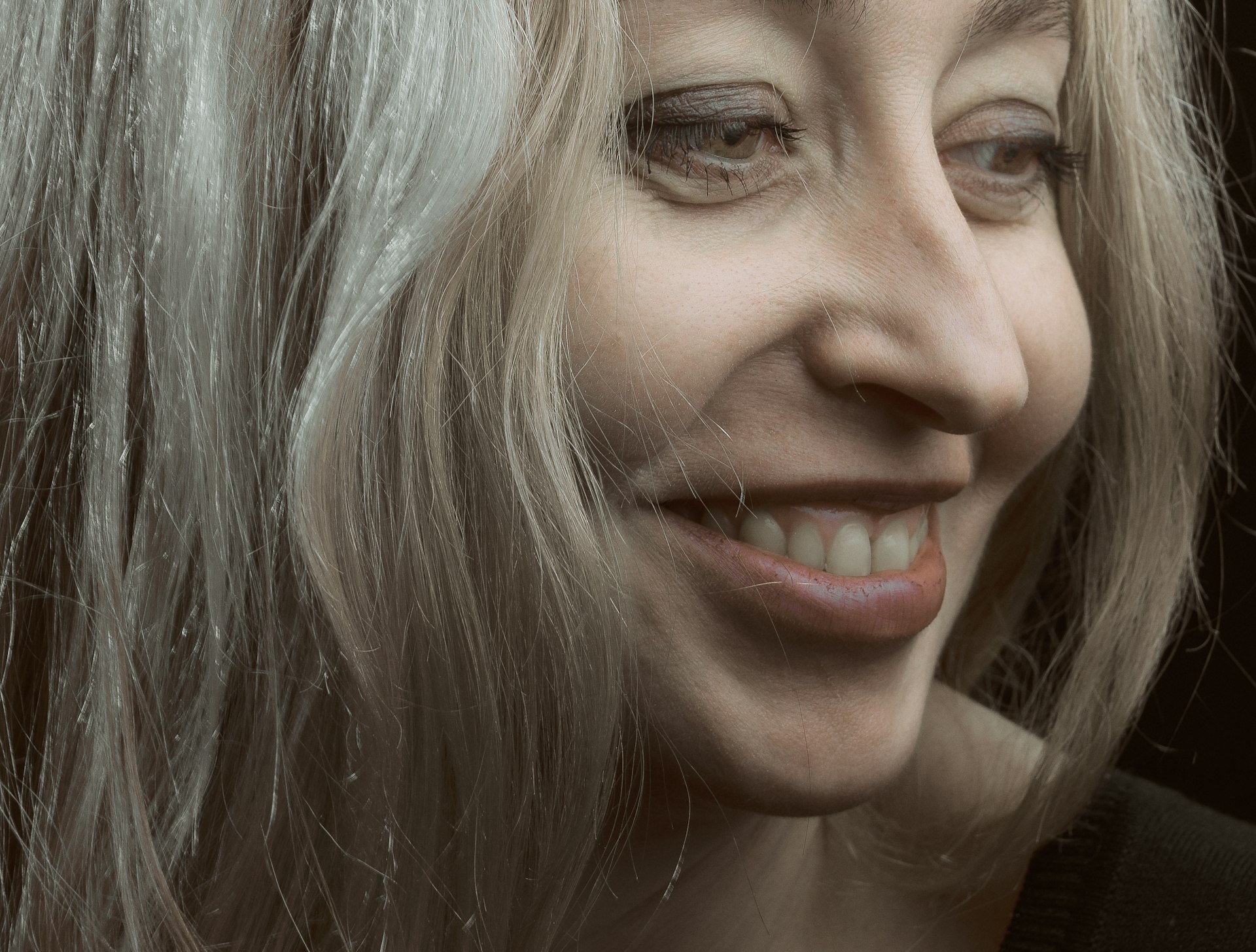 a close up of a person with blonde hair